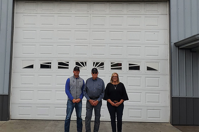 three-people-in-front-of-garage